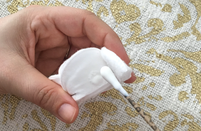 gluing cotton round 