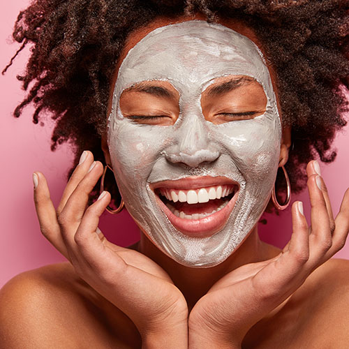 woman wearing clay face mask