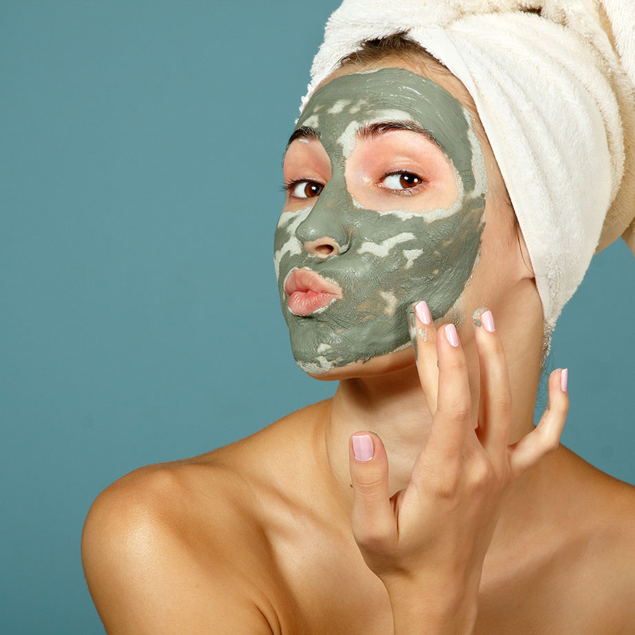woman wearing green face mask